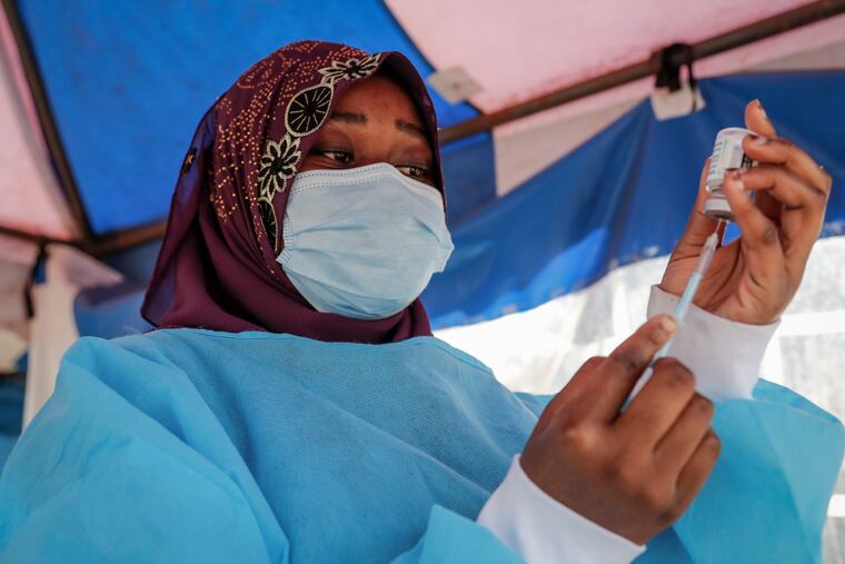 A nurse prepares to administer an AstraZeneca COVID-19 vaccine in Nairobi, Kenya, last month.