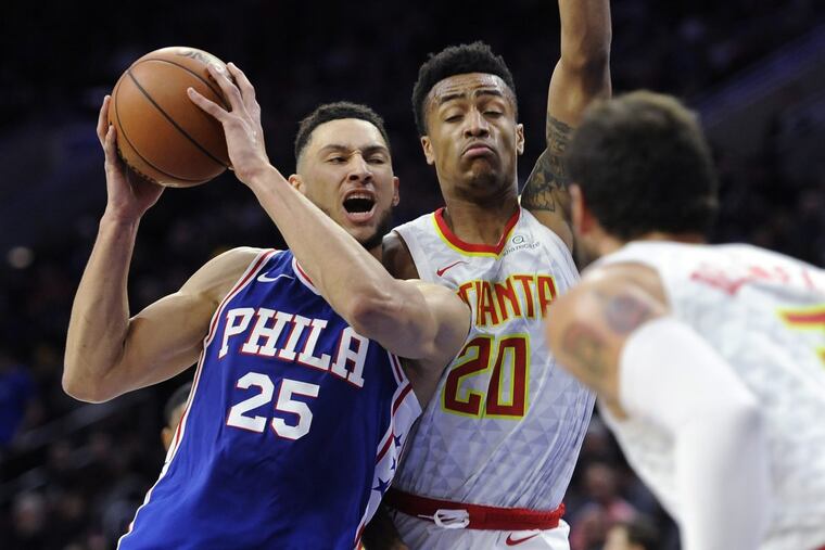 Ben Simmons (25) drives to the basket as Atlanta’s John Collins defends during the second half Wednesday night.
