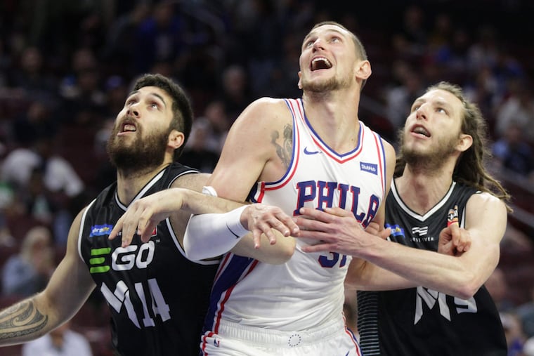 Mike Muscala (center) and Wilson Chandler won't necessarily fit seamlessly into the holes left by Ersan Ilyasova and Marco Belinelli, but they will be serviceable.