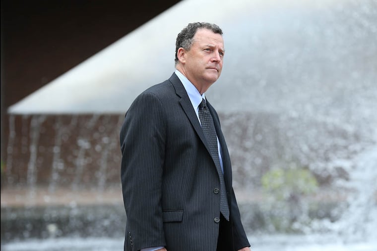 Robert Mulgrew, who was the former director of Friends of Dickinson Square, leaves federal court after he was sentenced to 2 1/2 years in prison in a fraud case involving the South Philadelphia nonprofit. He is seen leaving the court house in Philadelphia on August 6, 2014. DAVID MAIALETTI / Staff Photographer