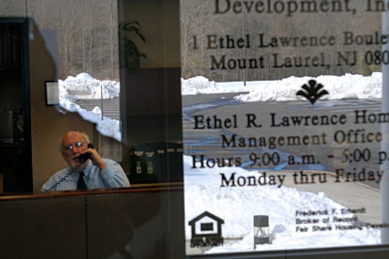 Peter O’Connor works the phone at Ethel R. Lawrence Homes, a Mount Laurel complex named for a plaintiff in the lawsuit that ultimately required communities to provide affordable housing. (TOM GRALISH / Staff Photographer)