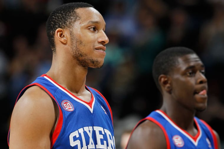 Evan Turner (12) reacts after missing two free throws with seconds remaining in the fourth quarter of the Denver Nuggets' 101-100 victory in an NBA basketball game in Denver, Thursday, March 21, 2013. (David Zalubowski/AP)