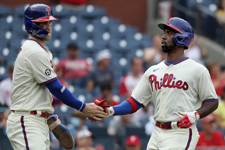 Bryce Harper (left), Andrew McCutchen (right) and the Phillies are running out of time to make their move on the Braves for the NL East.