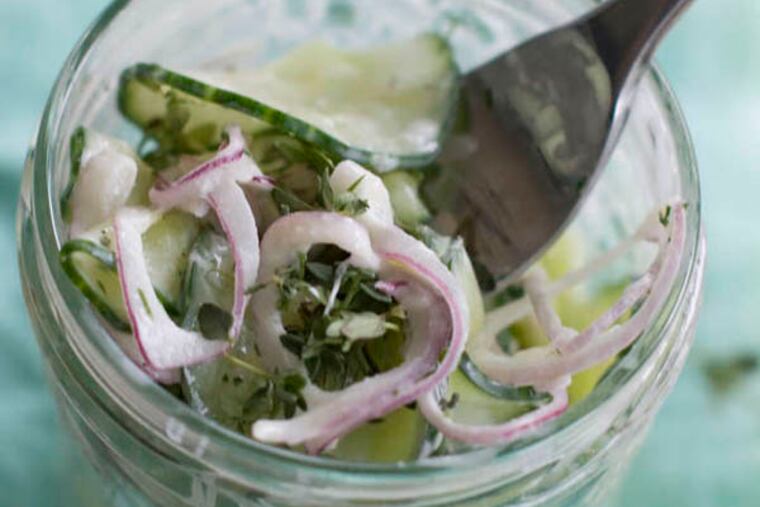 This July 22, 2013 photo taken in Concord, N.H. shows pressed cucumber salad with sour cream. (AP Photo/Matthew Mead)