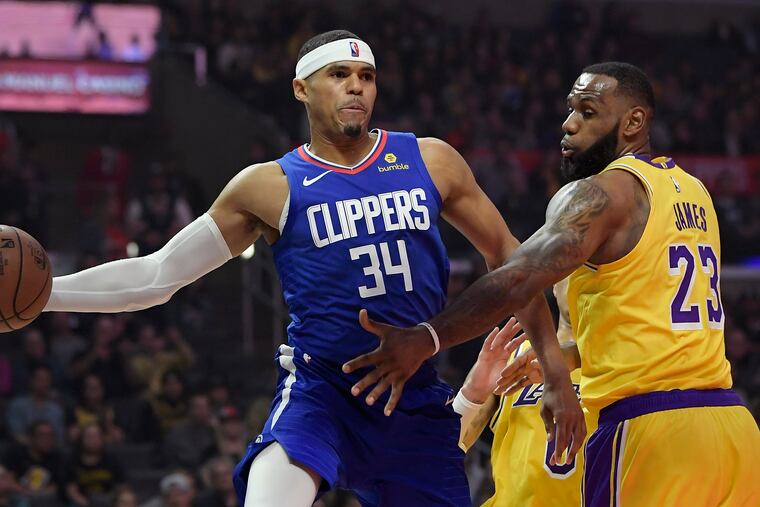 LeBron James will be in the Lakers' lineup on Sunday when they head to the Wells Fargo Center to face Tobias Harris and the upgraded Sixers. (Mark J. Terrill / AP Photo)