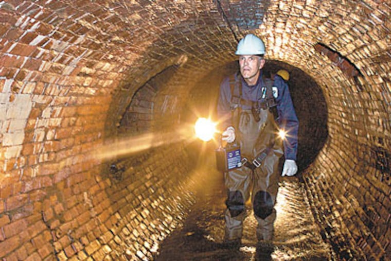 Adam Levine explores the West Philadelphia underground. He created a presentation to promote understanding of how public health and civil engineering affected the city's streams.