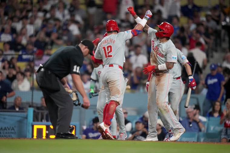 Kyle Schwarber (left) celebrates with teammates after hitting his second home run of the night in the sixth inning.