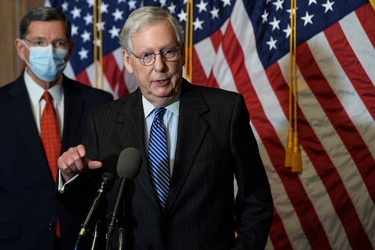 Senate Majority Leader Mitch McConnell (middle) blocked Democrats’ push to immediately bring President Donald Trump’s demand for bigger $2,000 COVID-19 relief checks up for a vote, saying the chamber would “begin a process” to address the issue.