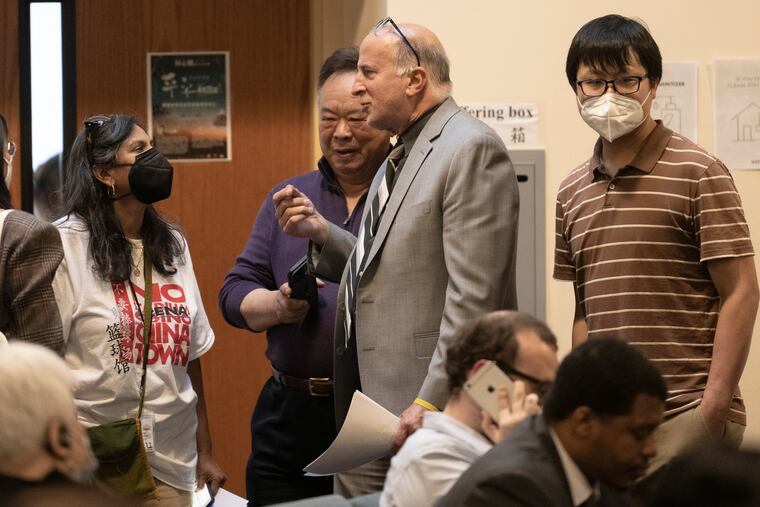 Councilmember Mark Squilla (center) speaks with Chinatown residents and supporters during a community meeting April 12 at the Chinese Christian Church & Center in Philadelphia.