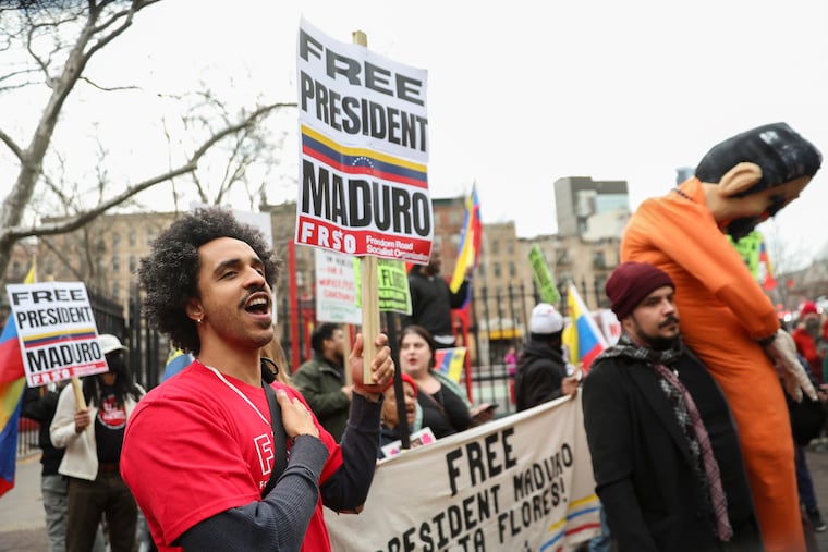 Demonstrators protest outside Manhattan federal court before Thursday's pre-trial hearing in former Venezuela President Nicolas Maduro's drug trafficking case.