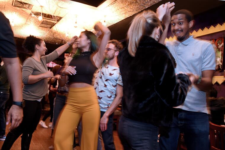 The free Tuesday night salsa social at Lucha Cartel with instructors from Estilo Dance Studio.