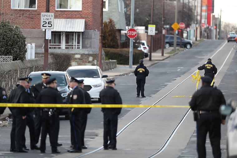Police gather at the scene of a quadruple shooting at 11th and Thompson Streets in Philadelphia on Feb. 19, 2020.