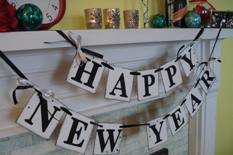 Hosting a New Year's party this year? Let everyone know! The lettering on this banner has been hand-stamped and antiqued for that perfect vintage look.