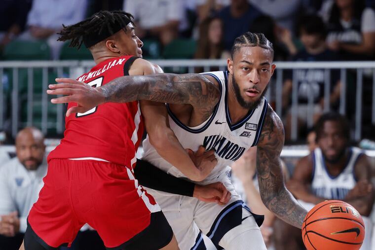 Villanova's Justin Moore (right) tries to get past Texas Tech's Chance McMillian on Thursday in the Battle 4 Atlantis.