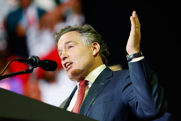 Dave McCormick speaks to a crowd during a June rally for Donald Trump at the Liacouras Center at Temple University.