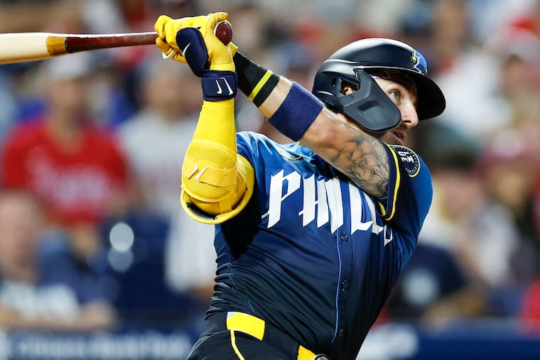 Phillies Bryson Stott watches his fourth-inning solo home run Friday against the Braves. The Phillies scored both of their runs via the long ball Friday night.