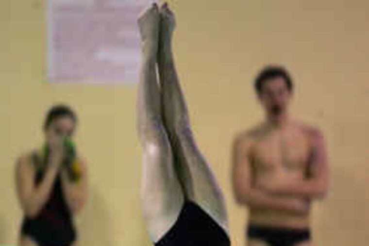 Caitlin Fechter dives for Haddonfield. She won the event, scoring 184.25, but Cherry Hill East beat Haddonfield, 103-83.