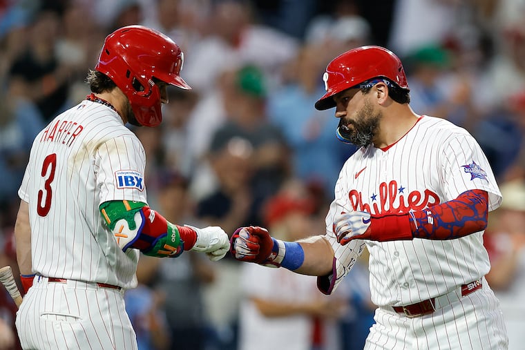 Bryce Harper hit for the cycle while Kyle Schwarber (right) hit three homers on Saturday night.
