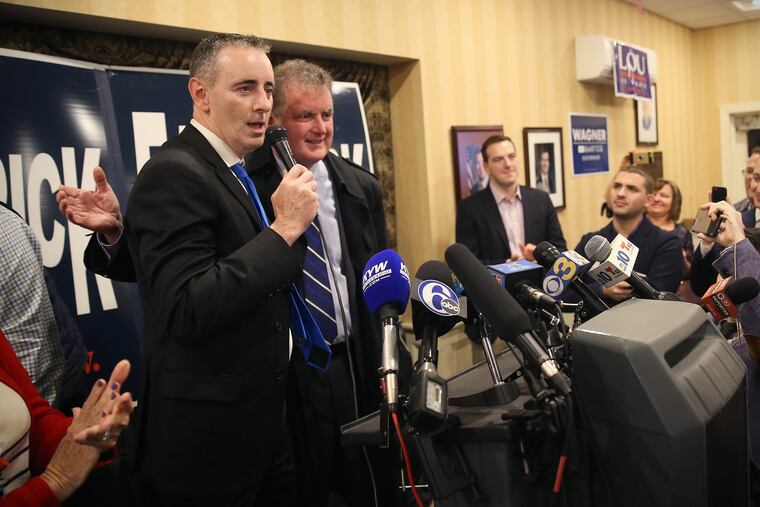 Rep. Brian Fitzpatrick, left, celebrates being re-elected with his brother, former congressman Mike Fitzpatrick.