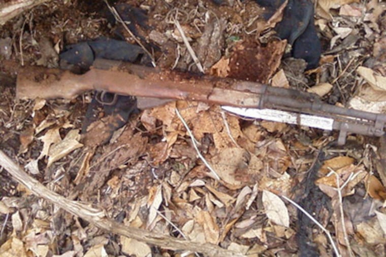 The rifle and jacket found by hiker Matt Hartzell in Norristown Farm Park on Monday. (Credit: Matt Hartzell)