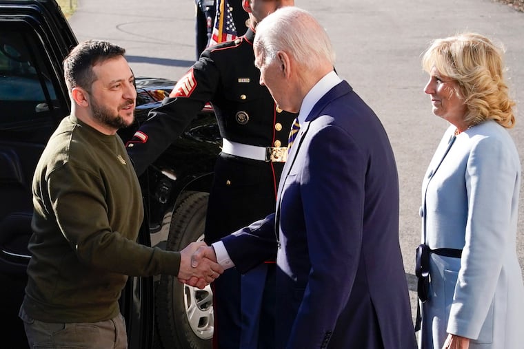 President Joe Biden (center) shakes hands with Ukrainian President Volodymyr Zelensky (left) as he and wife Jill welcome him to the White House on Wednesday.