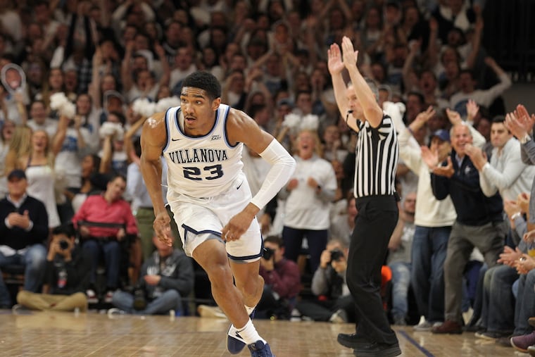 Villanova's Jermaine Samuels runs back on defense after hitting a three-pointer in the Wildcats' 67-61 victory over Marquette on Wednesday night.