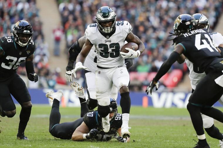 Eagles running back Josh Adams runs with the football against the Jacksonville Jaguars at Wembley Stadium in London on Sunday, October 28, 2018. YONG KIM / Staff Photographer