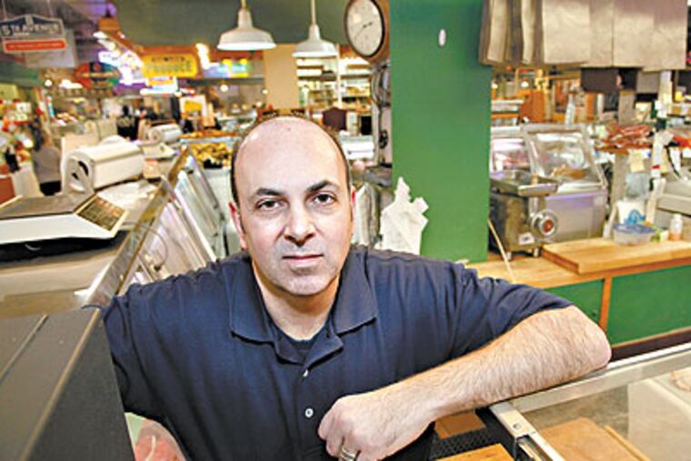 Nicholas Ochs, owner of Harry Ochs' butcher shop in the Reading Terminal Market on Thursday afternoon. (Laurence Kesterson / Staff Photographer)
