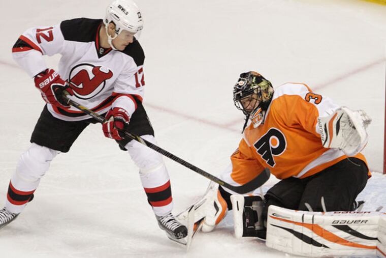 Ilya Bryzgalov blocks the shot of Devils' Alexei Ponikarovsky during the first period at the Wells Fargo Center in Philadelphia, Thursday, April 18, 2013. (Steven M. Falk/Staff Photographer)