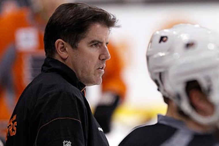 Season ticket holders were not given tickets to see Peter Laviolette and the Flyers in the Winter Classic. (Yong Kim/Staff file photo)