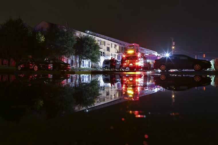 Firefighters at the scene of the fire Tuesday morning at the Canterbury Court Apartments in Northeast Philadelphia.