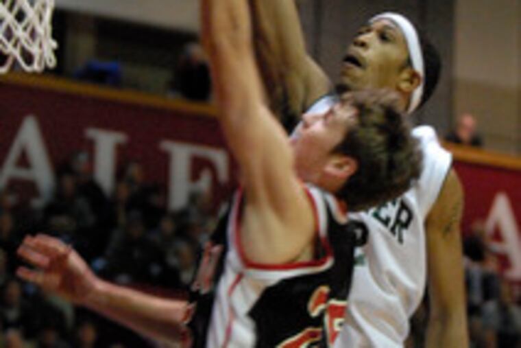 Ryan's Tom Marshall attempts a layup as Bonner's Lijah Thompson tries to swat the ball away in the PCL semifinal.