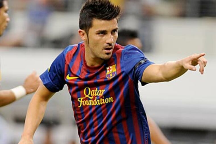 Barcelona's David Villa celebrates after his goal agaisnt Club America on Saturday. (Matt Strasen/AP)