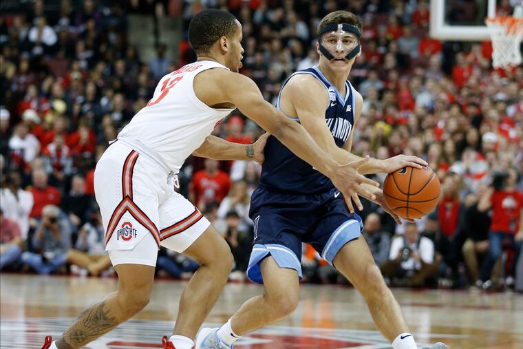 Villanova's Collin Gillespie brings the ball up against Ohio State's C.J. Walker during the first half.