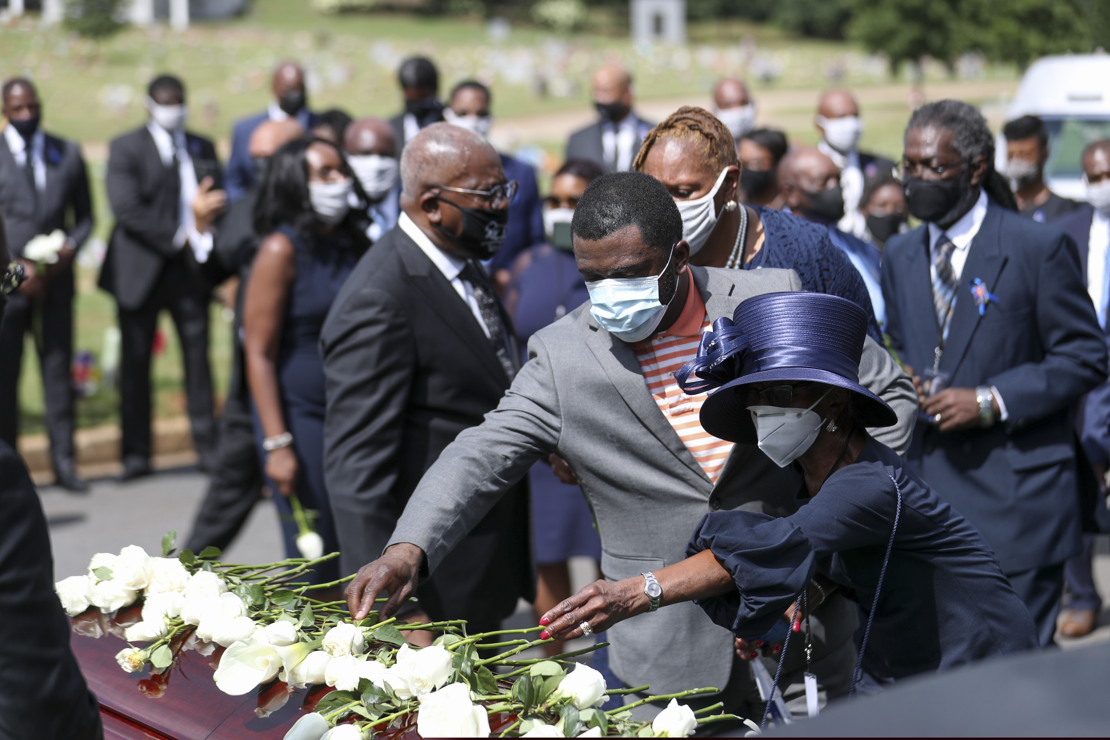 Family members place flowers on the casket of Rep. John Lewis during the burial service at South-View Cemetery in Atlanta.