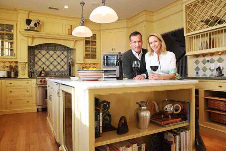 Brian and Elizabeth Litten in the kitchen, where they tried to replicate the feel of the kitchen in a farmhouse they had stayed in during a trip to Tuscany.