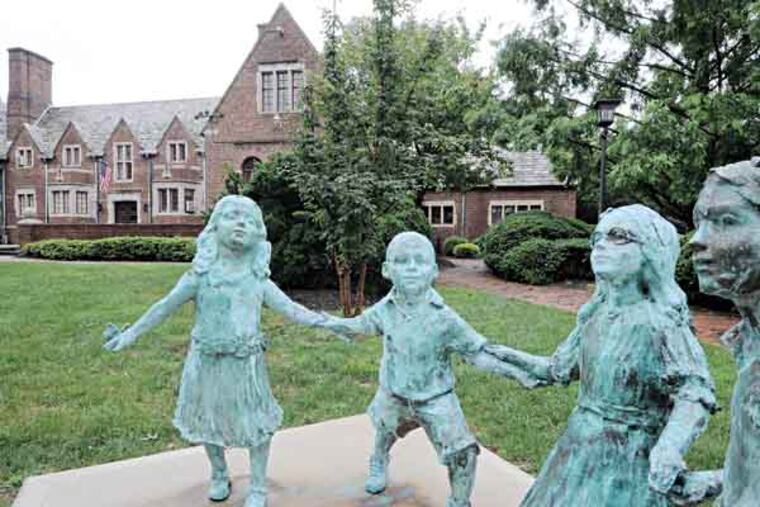 Moorestown, NJ. Statues in front of the Moorestown Community House on Main Street. ( APRIL SAUL / Staff )