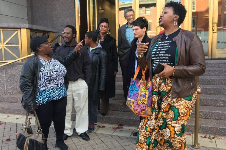 A group of Camden High School alumni emerge from federal court in Camden on Nov. 16, 2017, after a judge denied their request to halt demolition of their alma mater.