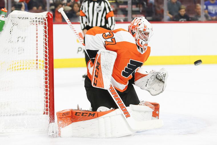 Flyers goaltender Brian Elliott watches the puck against the Bruins in a preseason game on Monday.