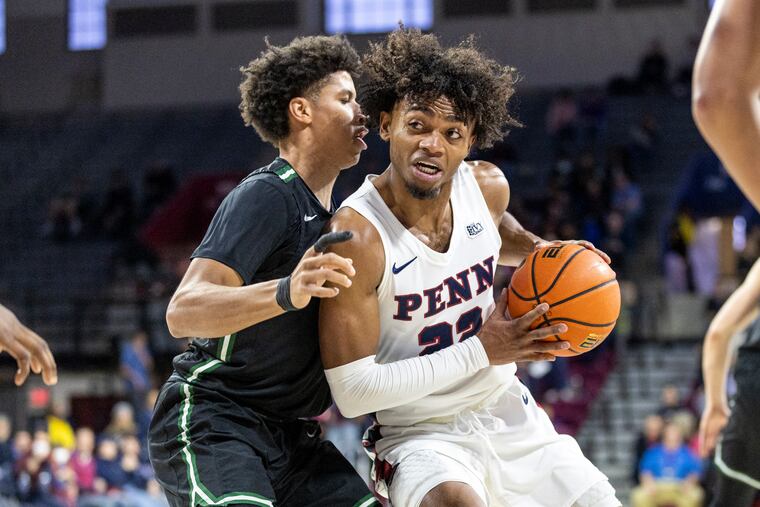Penn senior guard Lucas Monroe (22) drives toward the basket Saturday against Dartmouth. Monroe finished with 13 points on Senior Day at the Palestra.