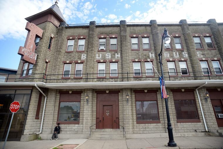 Robert Knight sits outside the Bush House Hotel in Quakertown,. A fatal fire at the end of April devastated the Bush house, and as community volunteers help tenants dust off and settle back in, they say they’ve come to better understand what the establishment means for the borough.