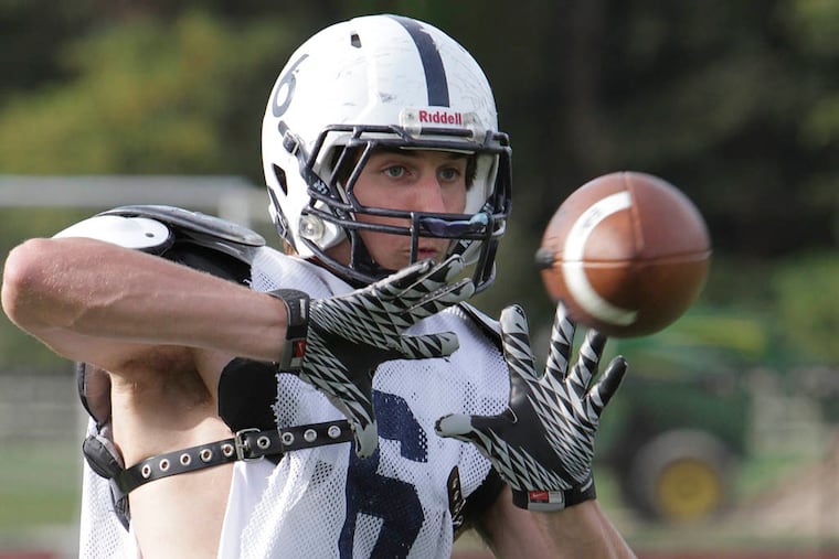 Episcopal Academy tight end Evan Butts catches a pass during practice. (STEVEN M. FALK / Staff Photographer)