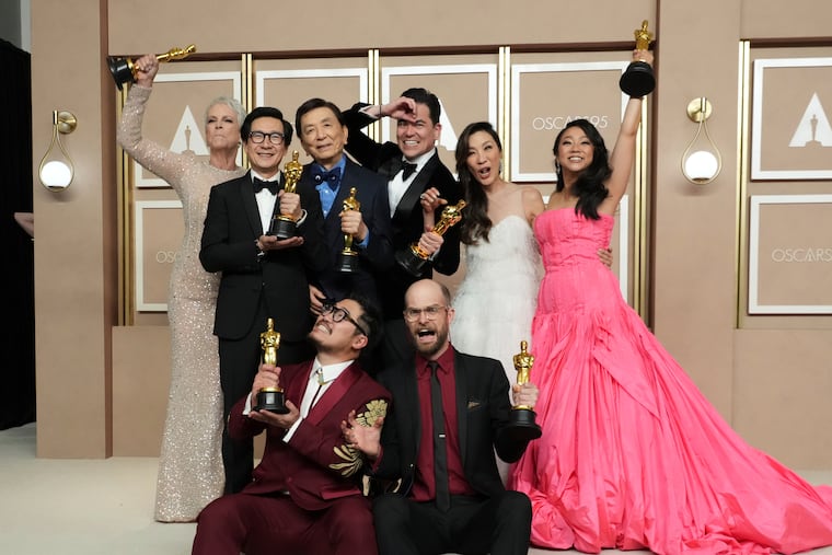 Jamie Lee Curtis, Ke Huy Quan, James Hong, Jonathan Wang, Michelle Yeoh, Stephanie Hsu, Daniel Kwan, and Daniel Scheinert celebrate after "Everything Everywhere All at Once" won best picture at the Oscars.