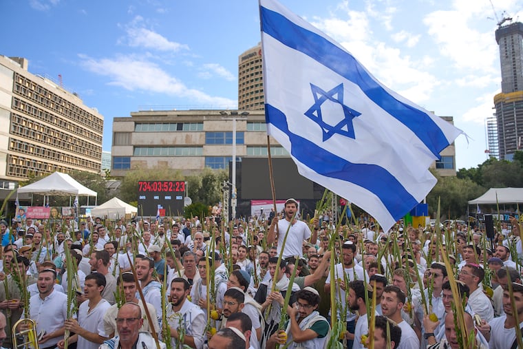 A celebration is held in Tel Aviv on Friday following the announcement that Israel and Hamas have agreed to the first phase of a peace plan to pause the fighting in Gaza.