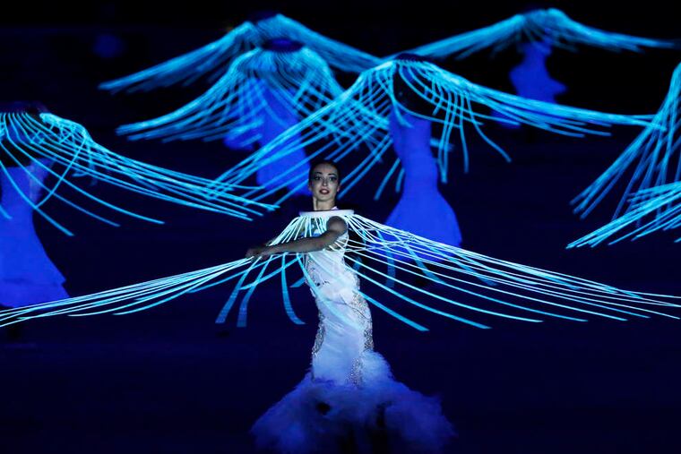 A light touch: Above, high-tech dancers at Sochi's opening ceremonies, which took a long-on-symbolism lap through Russian heritage and history. More coverage in Sports, D1.