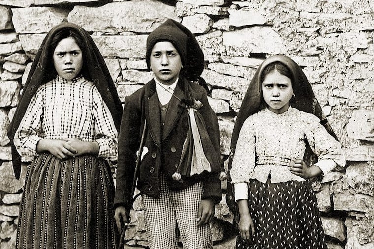 Lucia dos Santos, 10, (left) and her cousins Francisco Marto, 9, (center) and his 7 year-old sister Jacinta, who reported seeing apparitions of the Virgin Mary in Fatima, Portugal, in 1917.