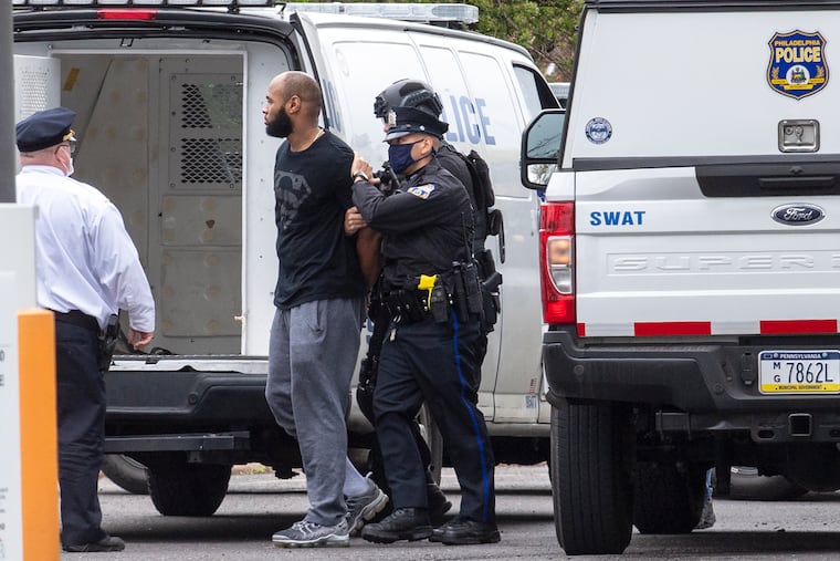 A man is arrested after a barricade situation in connection with the abduction of a missing 2-year old boy at a hotel near the Philadelphia International Airport on Monday.