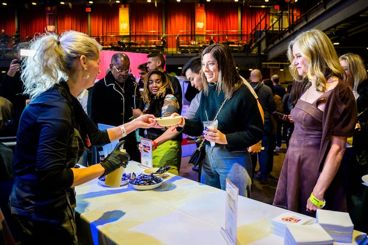 Chef Jen Carroll hands attendees food during the first Inquirer Food Fest at the Fillmore in 2025.