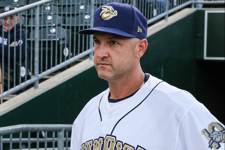 After 10 years managing in the Phillies minor-league system, Dusty Wathan appears to be a finalist for the big-league job.