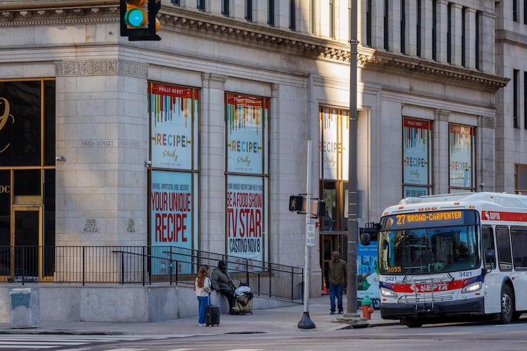 Window signs for Recipe Philly hanging at the One City building at Broad and Arch Streets.